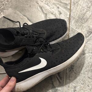 Nike Men’s Black Sneakers with White Swoosh